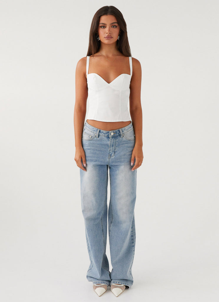 Womens Naomi Backless Top in the colour White in front of a light grey background