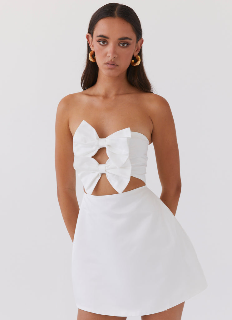 Womens Girl Crush Bow Mini Dress in the colour White in front of a light grey background