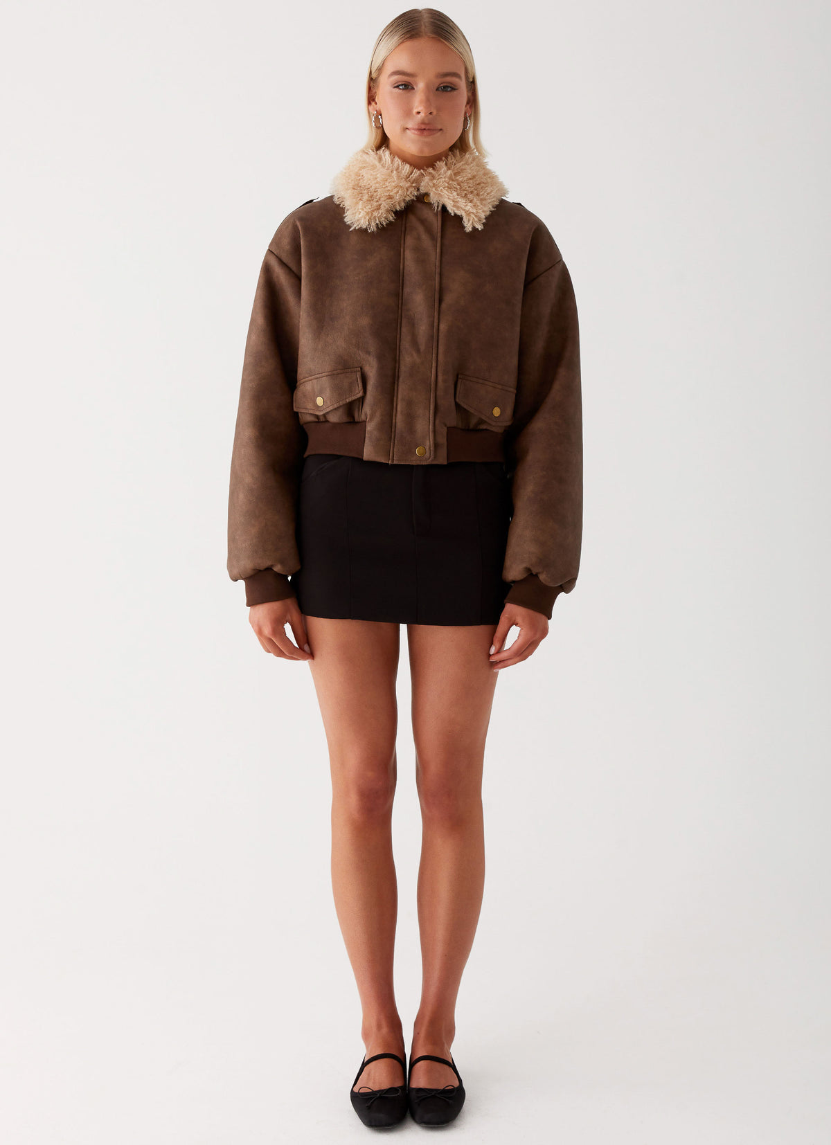 Womens Aston Shearling Bomber Jacket in the colour Brown in front of a light grey background