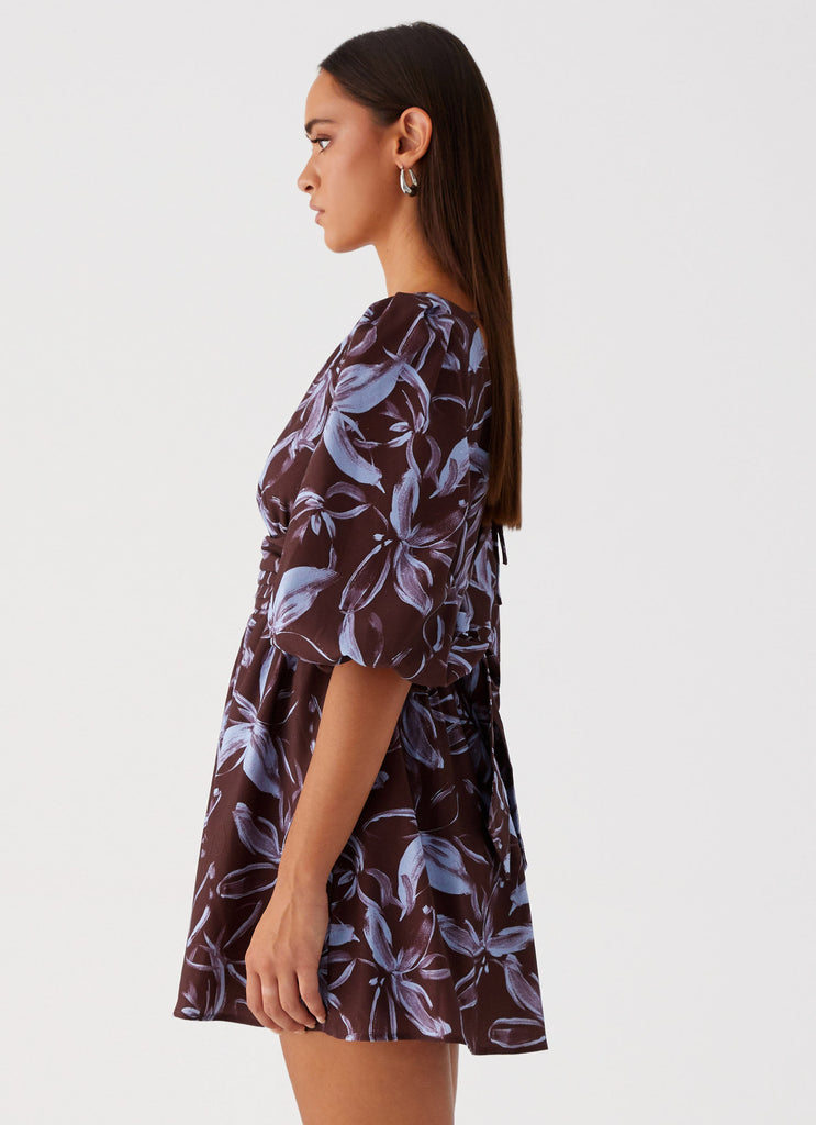 Womens Crystal Dreams Mini Dress in the colour Brown Purple Floral in front of a light grey background