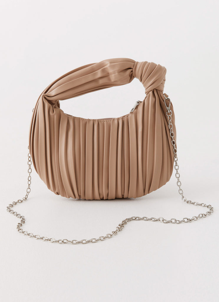 Womens Gracelyn Bag in the colour Nude in front of a light grey background