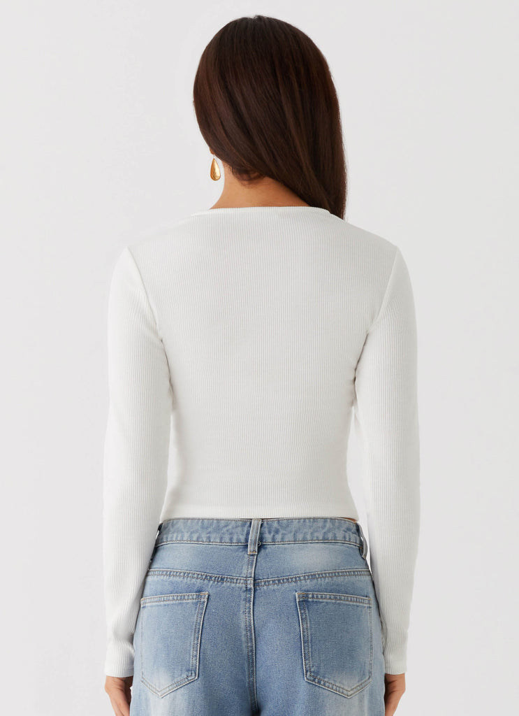 Womens Kellie Long Sleeve Knit Top in the colour White in front of a light grey background