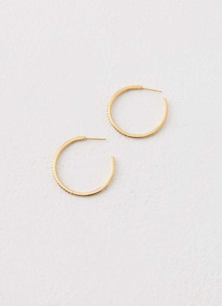 Womens Lilyanna Earrings in the colour Gold in front of a light grey background