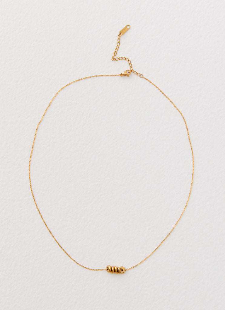 Womens Link Up Necklace in the colour Gold in front of a light grey background