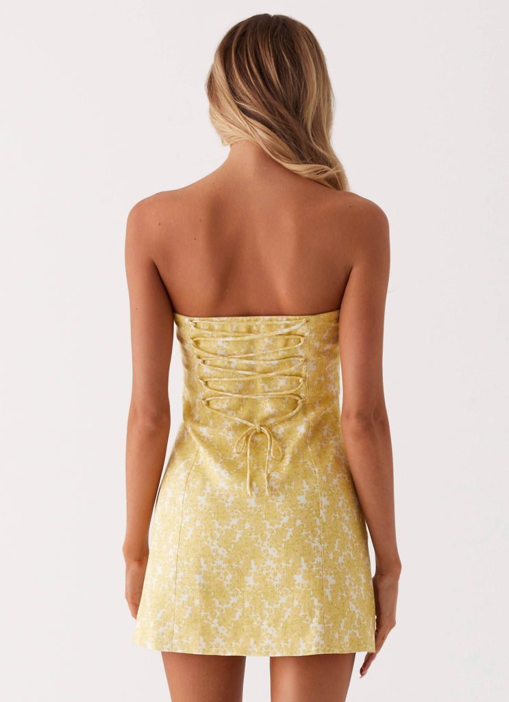 Womens Livvy Strapless Mini Dress in the colour Yellow Floral in front of a light grey background