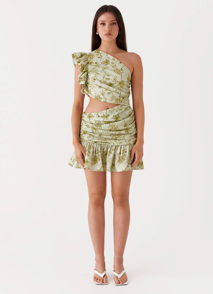 Womens Maisie Linen Mini Dress in the colour Sage Floral in front of a light grey background