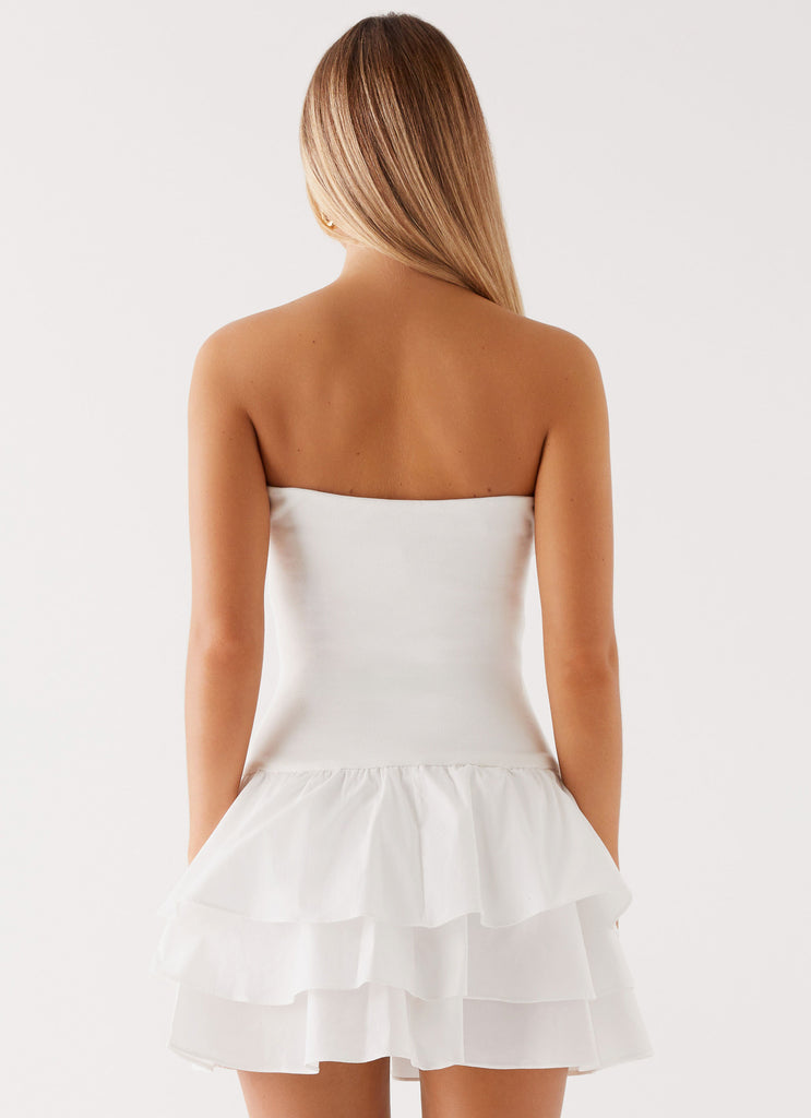 Womens Martha Ruffle Mini Dress in the colour White in front of a light grey background