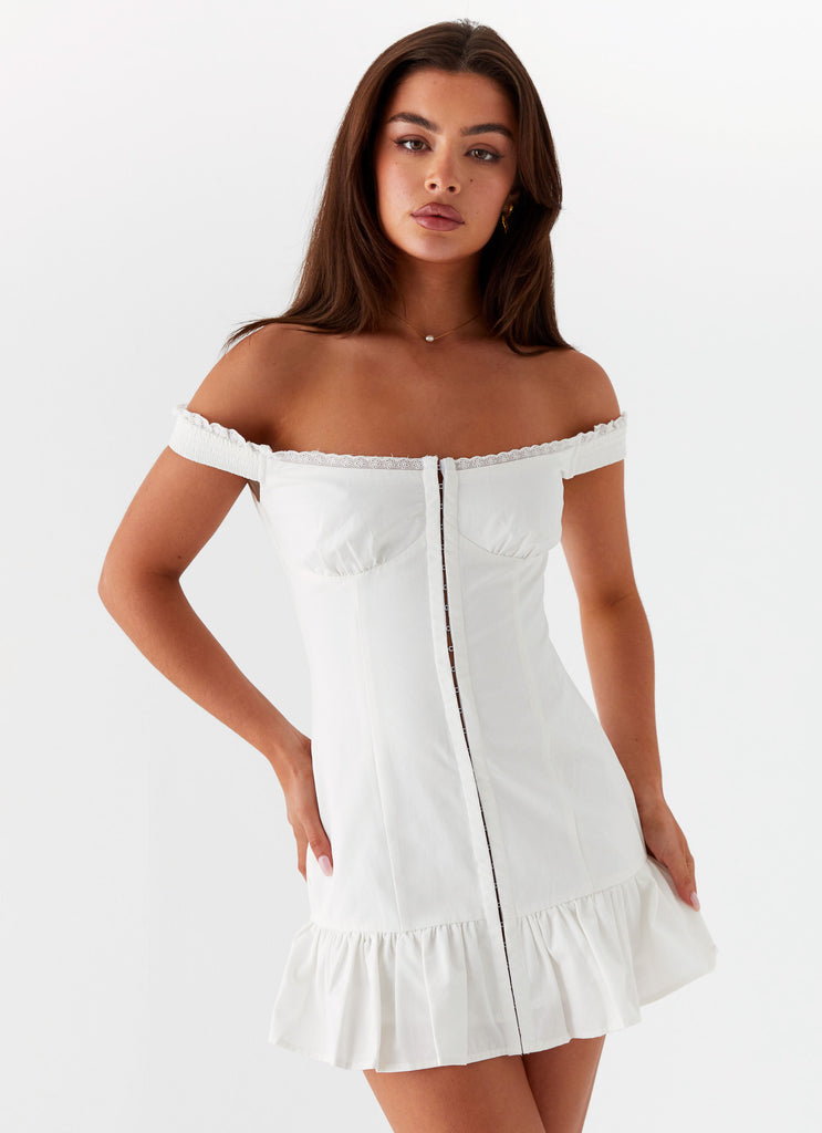 Womens Odessa Frill Mini Dress in the colour White in front of a light grey background