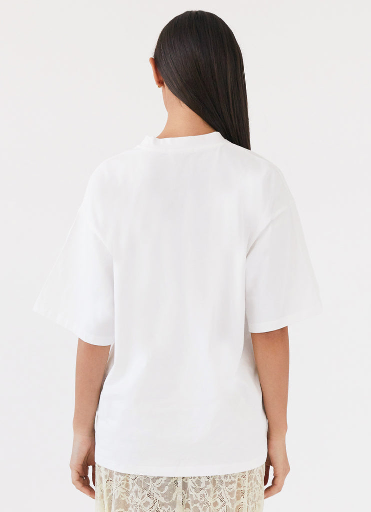 Womens Lillies Oversized Tee in the colour White in front of a light grey background