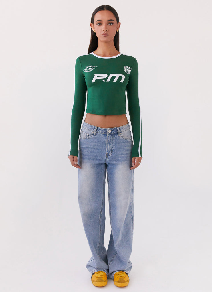 Womens Touch Base Long Sleeve Top in the colour Pine Green in front of a light grey background