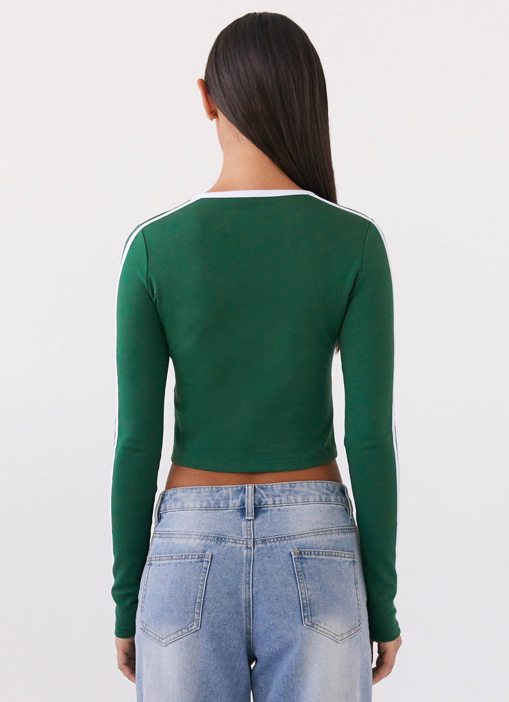 Womens Touch Base Long Sleeve Top in the colour Pine Green in front of a light grey background