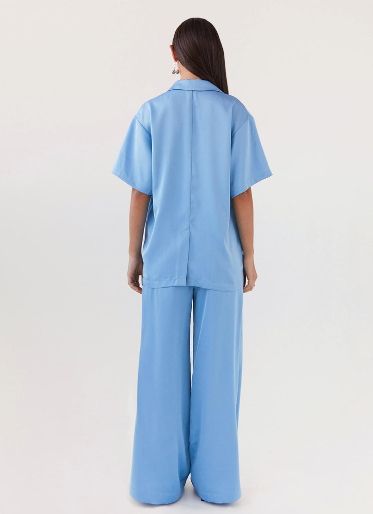 Womens Brinkley Oversized Satin Shirt in the colour Sky Blue in front of a light grey background