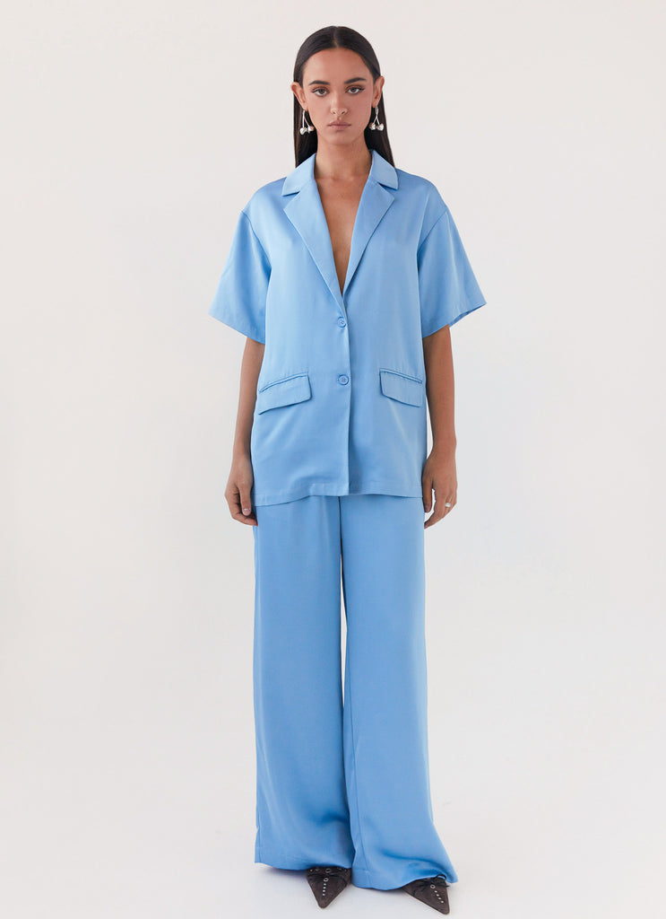 Womens Brinkley Satin Pants in the colour Blue in front of a light grey background