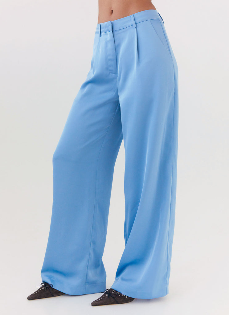 Womens Brinkley Satin Pants in the colour Blue in front of a light grey background