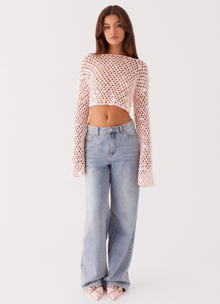 Womens Issy Crochet Long Sleeve Crop Top in the colour Pink in front of a light grey background