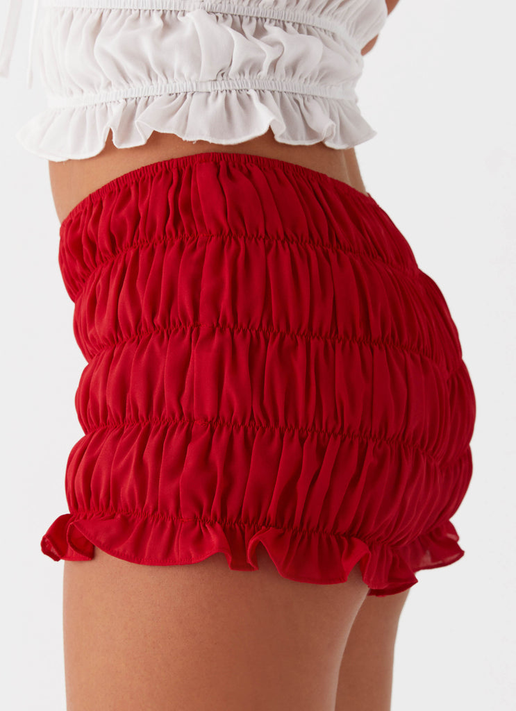 Womens Girls Like Us Ruched Mini Shorts in the colour Red in front of a light grey background