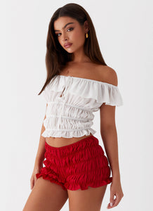 Womens Girls Like Us Ruched Mini Shorts in the colour Red in front of a light grey background