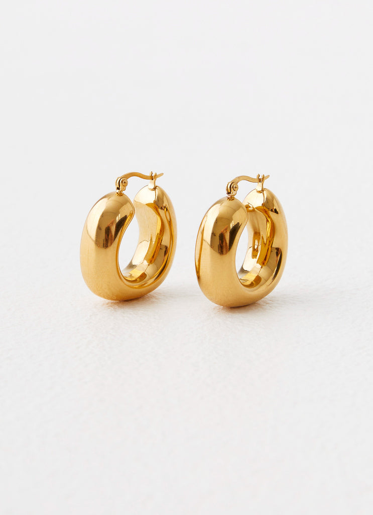 Womens Sweet Distraction Earrings in the colour Gold in front of a light grey background