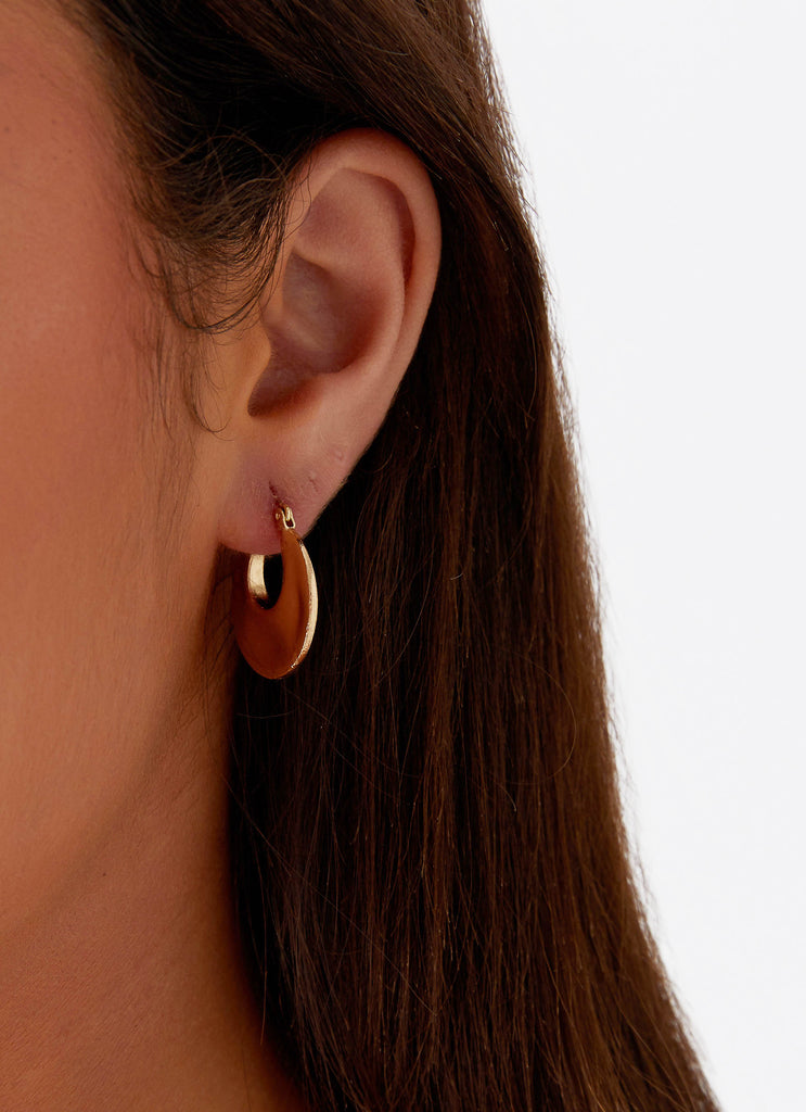 Womens Nobody Else Earrings in the colour Gold in front of a light grey background