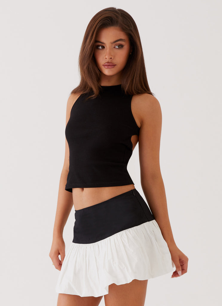 Womens Riva Bubble Hem Mini Skirt in the colour Black Ivory in front of a light grey background