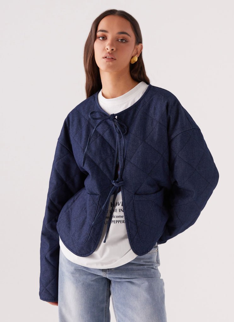 Womens Faded Fall Quilted Jacket in the colour Vintage Blue Wash in front of a light grey background