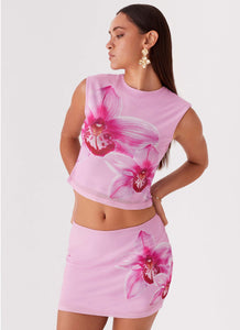 Womens Sunset Bliss Mesh Mini Skirt in the colour Pink Magnolia in front of a light grey background