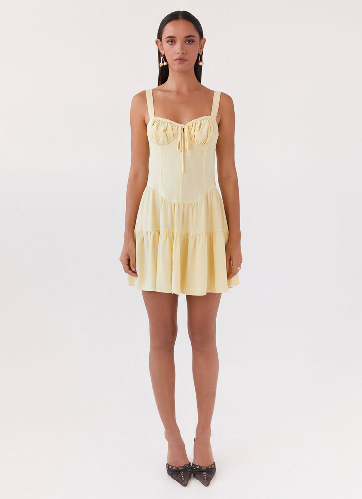 Womens Lucie Linen Mini Dress in the colour Yellow in front of a light grey background