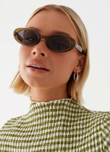 Womens Raphy Sunglasses in the colour Khaki in front of a light grey background