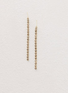 Womens Reina Earrings in the colour Gold in front of a light grey background