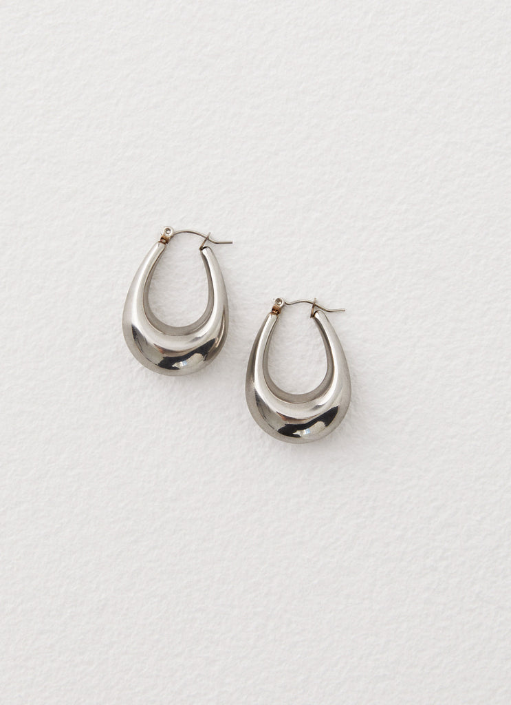 Womens Slow Down Earrings in the colour Silver in front of a light grey background