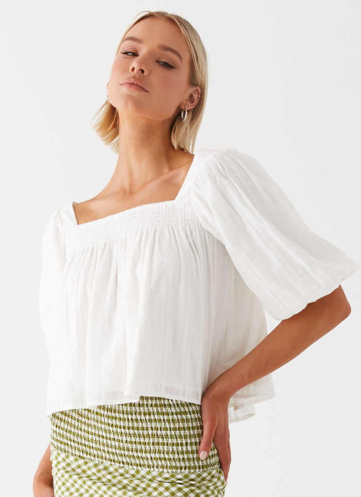 Womens Tanika Puff Sleeve Top in the colour White in front of a light grey background