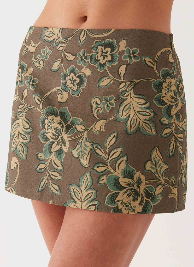 Womens Tonnie Floral Mini Skirt in the colour Brown Floral in front of a light grey background