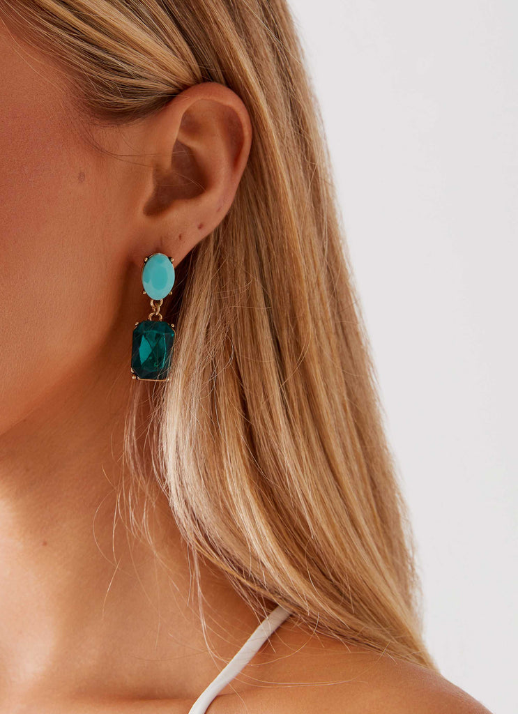 Womens Under The Moonlight Earrings in the colour Green in front of a light grey background