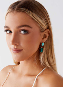 Womens Under The Moonlight Earrings in the colour Green in front of a light grey background