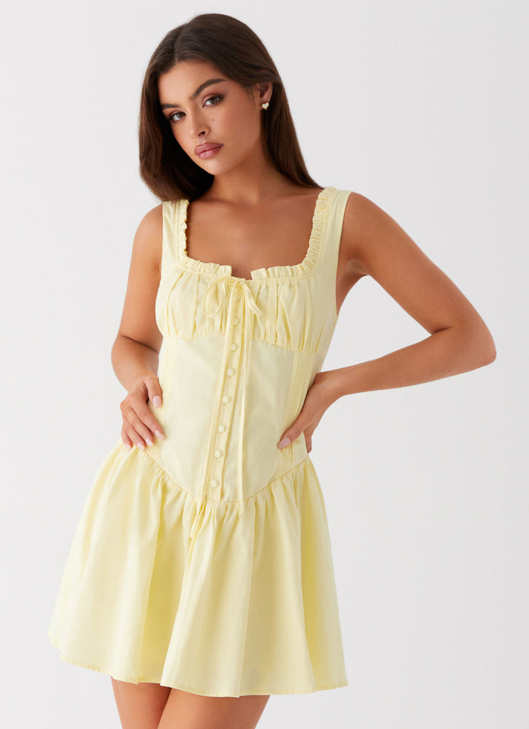 Womens Wren Mini Dress in the colour Yellow in front of a light grey background