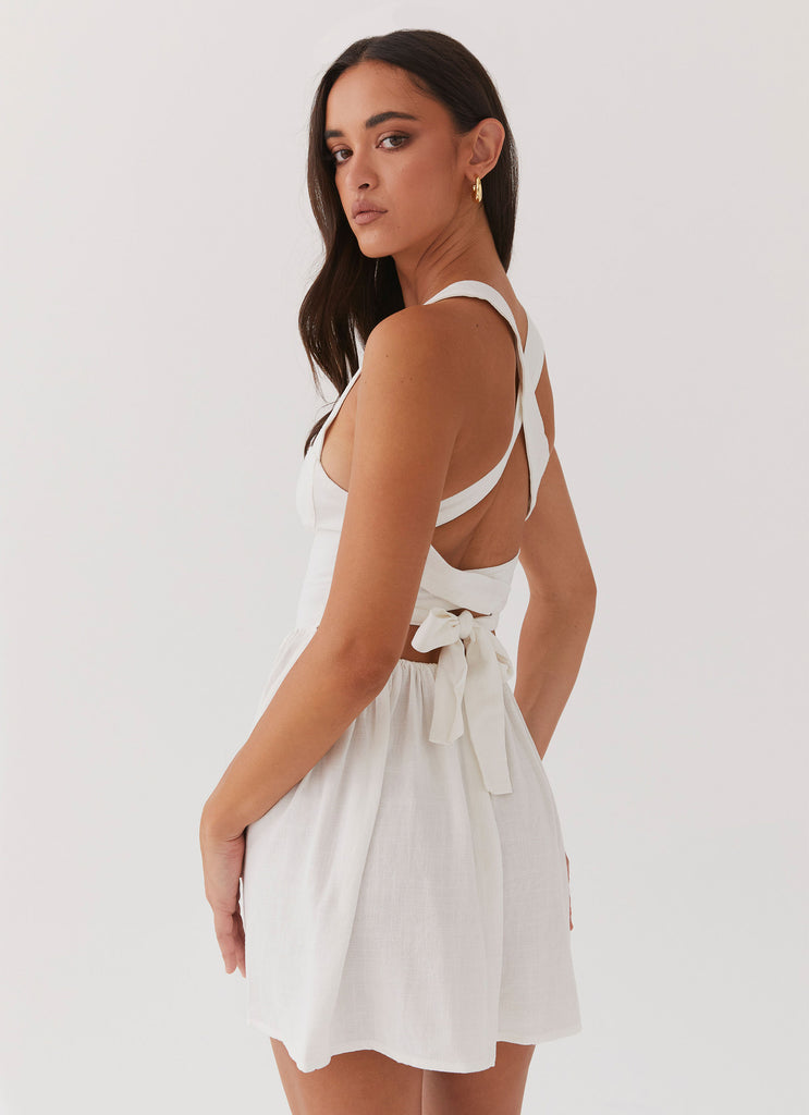 Womens Penelope Linen Mini Dress in the colour Ivory in front of a light grey background