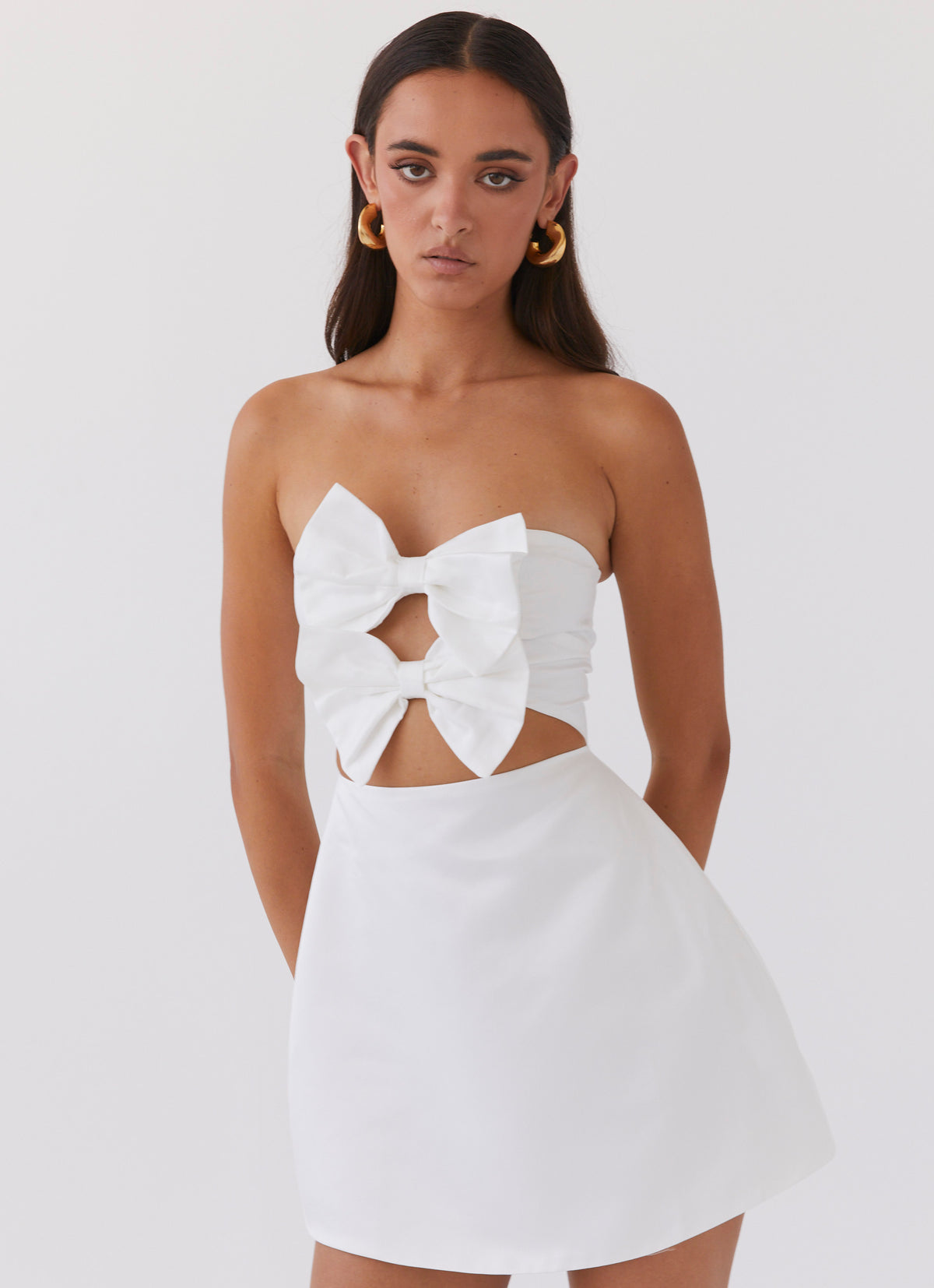 Womens Girl Crush Bow Mini Dress in the colour White in front of a light grey background