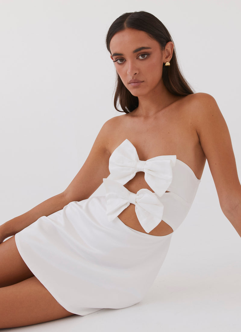 Womens Girl Crush Bow Mini Dress in the colour White in front of a light grey background