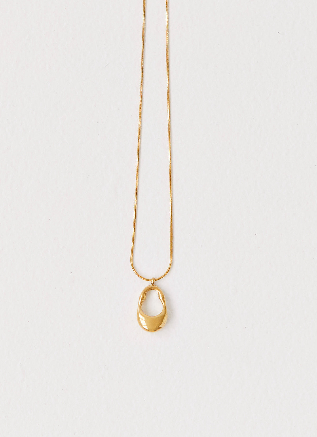Womens Blissful Necklace in the colour Gold in front of a light grey background